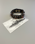 Bracelet. Leather+ stud+ red triangular rhinestones. Color: Grey. X2867 C0501.