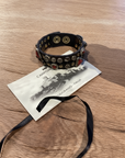 Bracelet. Leather+ stud+ red triangular rhinestones. Color: Grey. X2867 C0501.