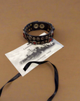 Bracelet. Leather+ stud+ red triangular rhinestones. Color: Grey. X2867 C0501.