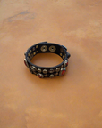 Bracelet. Leather+ stud+ red triangular rhinestones. Color: Grey. X2867 C0501.